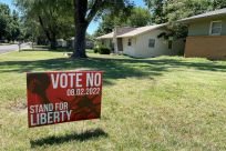 Yard signs in urge residents to vote on an amendment to Kansas' constitution that would assert there is no right to abortion, in Wichita, Kansas, U.S., July 10, 2022. 