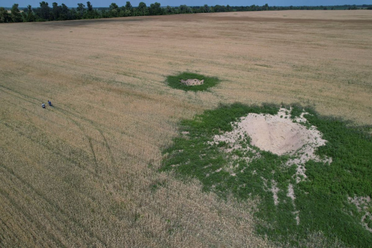 Shell craters are seen in a wheat field near the village of Hrabivka, as Russia's attack on Ukraine continues, in Chernihiv region, Ukraine July 5, 2022.  