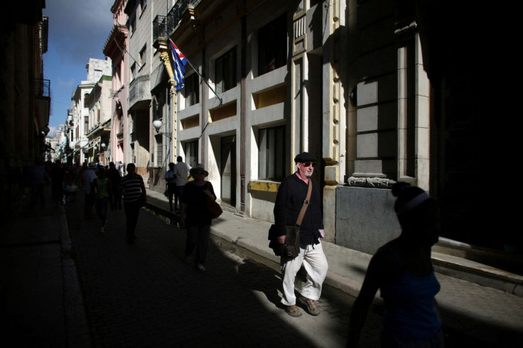 A tourist walks on the main touristic road in Old Havana, Cuba, May 4, 2016.