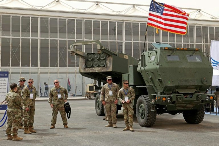 US military personnel in Saudi Arabia stand in March 2022 by a M142 High Mobility Artillery Rocket System (Himars)-- which has been put to use by Ukraine against Russian invaders