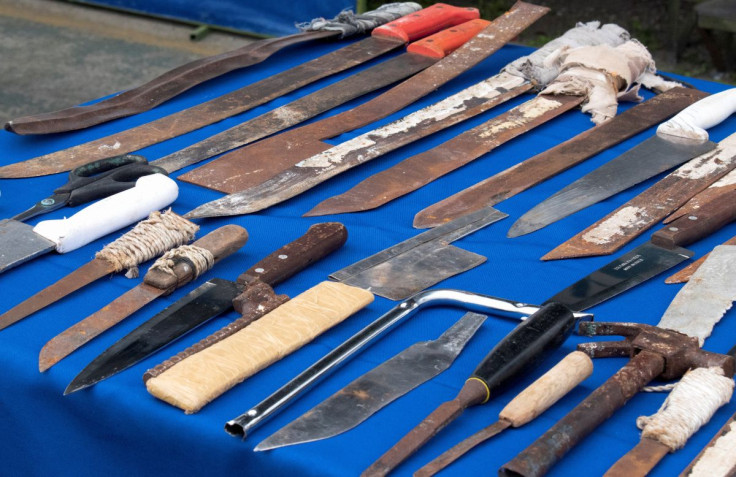 Weapons and knives seized by security members searching areas inside the Santo Domingo penitentiary are shown to the media during a news conference in a Police Command building in Santo Domingo de los Tsachilas as Ecuador's government on Tuesday said it w