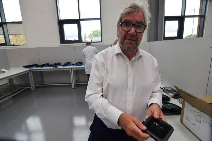 David Martell, CEO of British electric vehicle home charger maker EVIOS, holds part of a charger at the companyâs headquarters in Bedford, Britain, May 23, 2022.