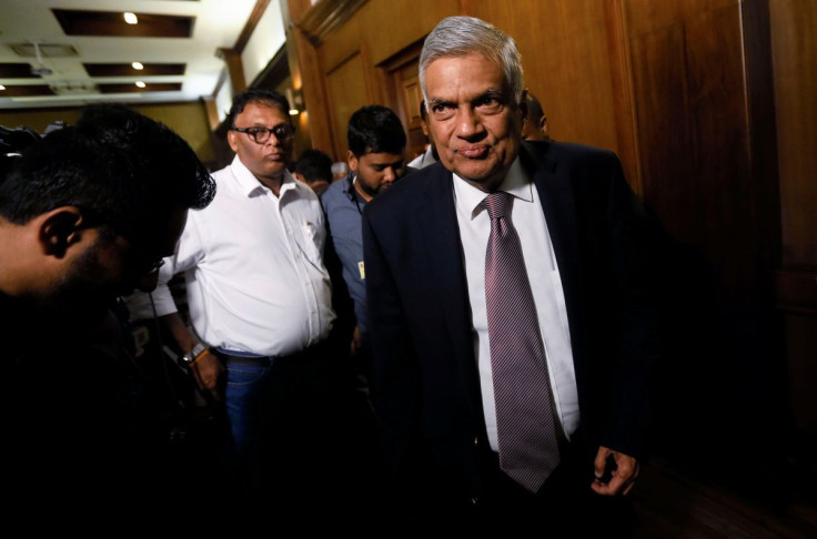Sri Lankan Prime Minister Ranil Wickremesinghe leaves after a news conference in Colombo, Sri Lanka February 16, 2018.