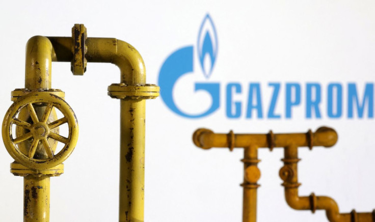 Model of natural gas pipeline and Gazprom logo, July 18, 2022. 