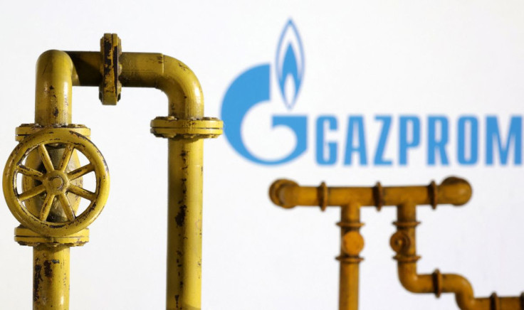 Model of natural gas pipeline and Gazprom logo, July 18, 2022.