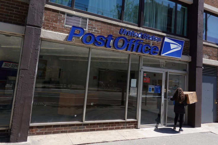 A person enters a United States Postal Service (USPS) Post Office in Manhattan, New York City, U.S., May 9, 2022. 