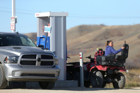 People get fuel at the Cowessess First Nation gas station near Grayson, Saskatchewan, Canada October 19, 2021. 
