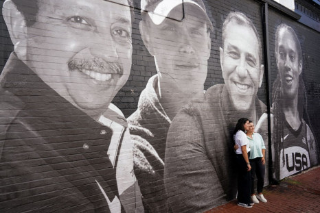 People visit a mural of Brittney Griner and other hostages around the world created by the Bring Our Families Home Campaign, a campaign led by family members of Americans wrongfully detained or held hostage abroad, in the  Georgetown neighborhood of Washi