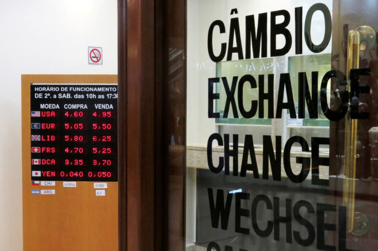 A board displays the Brazilian Real-U.S. dollar and other exchange rates in Sao Paulo, Brazil March 16, 2020