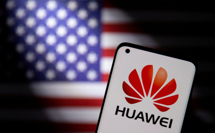 Smartphone with a Huawei logo is seen in front of a U.S. flag in this illustration taken September 28, 2021. 