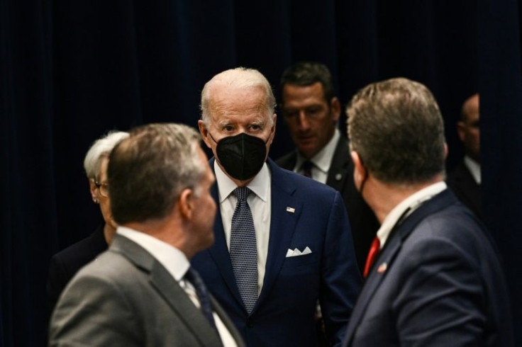 In this file photo taken on May 13, 2022, President Joe Biden wears a mask as he arrives for the US-ASEAN Special Summit at the US State Department in Washington