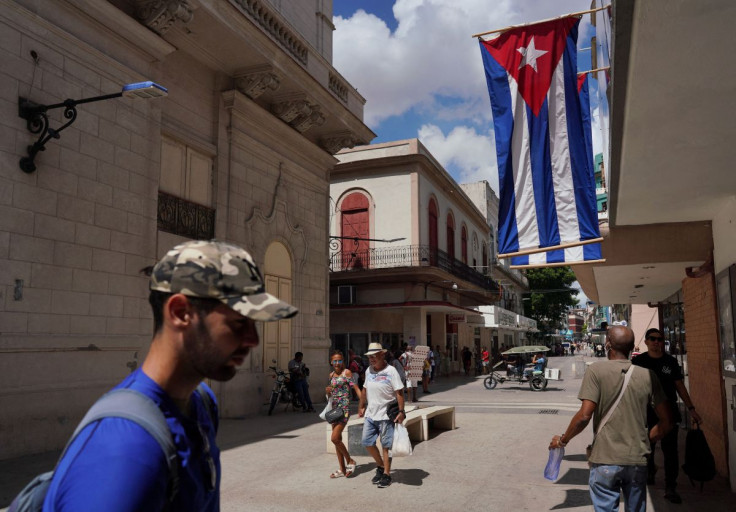 Cuban flags are displayed at a commercial road in downtown Havana, Cuba, July 20, 2022. 