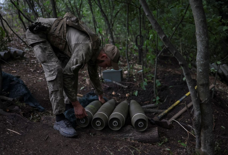 A Ukrainian service member prepares shells for a M777 Howitzer at a front line, as Russia's attack on Ukraine continues, in Kharkiv Region, Ukraine July 21, 2022. 