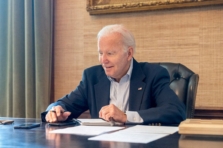 U.S. President Joe Biden, who tested positive for COVID-19 while experiencing mild symptoms, sits at his desk in the White House residence in this handout photo obtained from President Biden's Twitter account on July 21, 2022. Courtesy Twitter President B