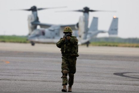 A Japanese Ground Self-Defense Force (JGSDF) soldier takes part in a military demonstration in front of V-22 Osprey during the Pacific Amphibious Leaders Symposium 2022 (PALS22) at JGSDF Kisarazu base in Kisarazu, east of Tokyo, Japan June 16, 2022. 