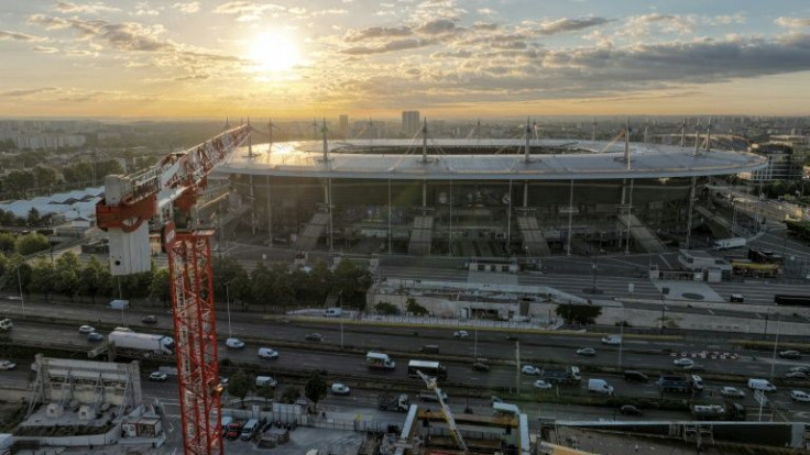 Rising costs: construction work continues on an aquatic arena across the main road from the Stade de France