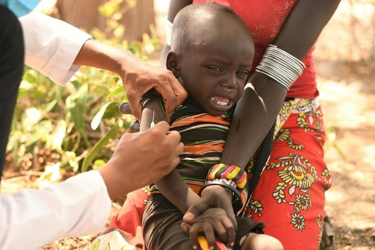 A single doctor checks dozens of mothers and infants for malnutrition during a twice-monthly visit to Purapul