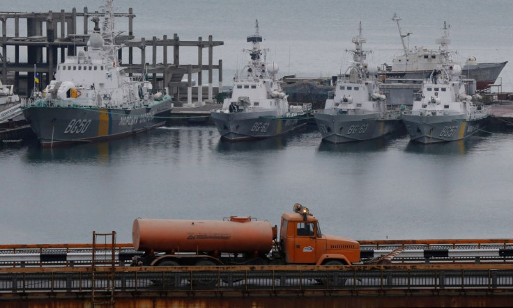 A tanker truck drives past Ukrainian border guard boats docked in the Black Sea port of Odessa, Ukraine November 26, 2018. 