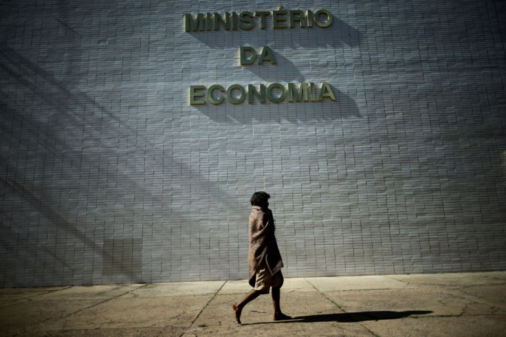 A homeless walks near the Ministry of the Economy building in Brasilia, Brazil March 23, 2022. 