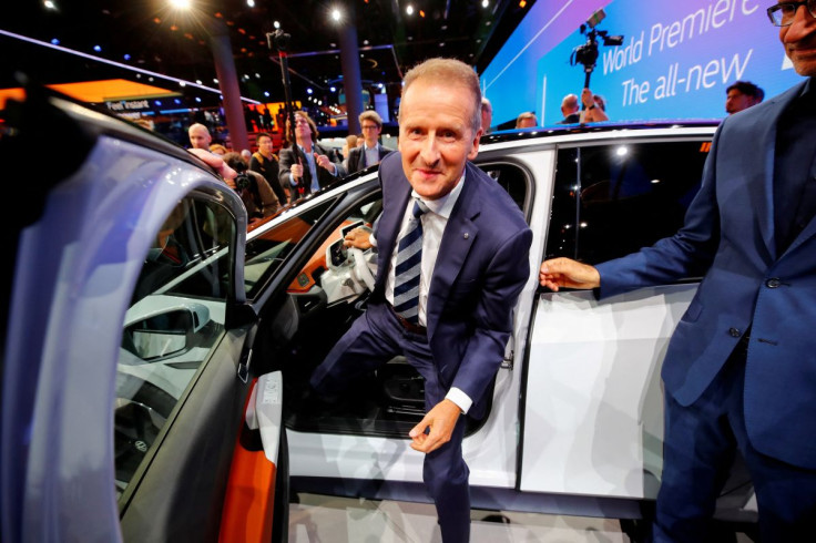 Herbert Diess, CEO of German carmaker Volkswagen AG, poses in an ID.3 pre-production prototype during the presentation of Volkswagen's new electric car on the eve of the International Frankfurt Motor Show IAA in Frankfurt, Germany September 9, 2019.