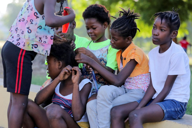 Haitian children who escaped violence in the town of Cite-Soleil take refuge at a school, in Port-au-Prince, Haiti, July 22, 2022.