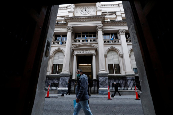A man walks past the facade of Argentinaâs Central Bank, in Buenos Airesâ financial district, Argentina, July 4, 2022. 