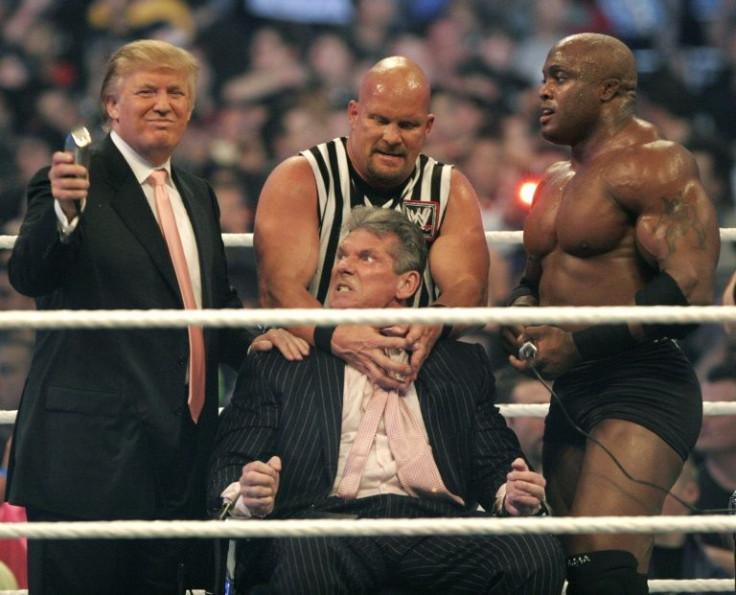 WWE chairman Vince McMahon (C) prepares to have his head shaved by Donald Trump (L) and Bobby Lashley (R) while being held down by 'Stone Cold' Steve Austin after losing a Battle of the Billionaires best at the Wrestlemania event in Detroit in April 2007