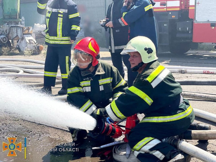 Firefighters work to put out a fire caused by a missile attack, as Russia's invasion of Ukraine continues, in Odesa's port, Ukraine in this handout picture released July 23, 2022. State Emergency Service of Ukraine/Handout via REUTERS    