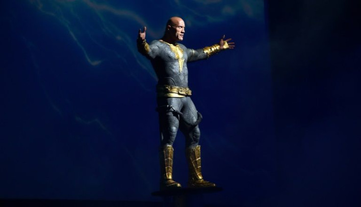 Actor Dwayne "The Rock" Johnson made a grand entrance at Comic-Con in San Diego, California, appearing in full superhero costume raised above the stage amid smoke and thunder effects, to promote the film "Black Adam"