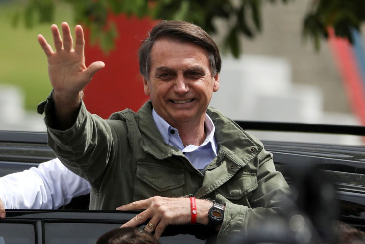 Jair Bolsonaro, far-right lawmaker and presidential candidate of the Social Liberal Party (PSL), gestures at a polling station in Rio de Janeiro, Brazil October 28, 2018.