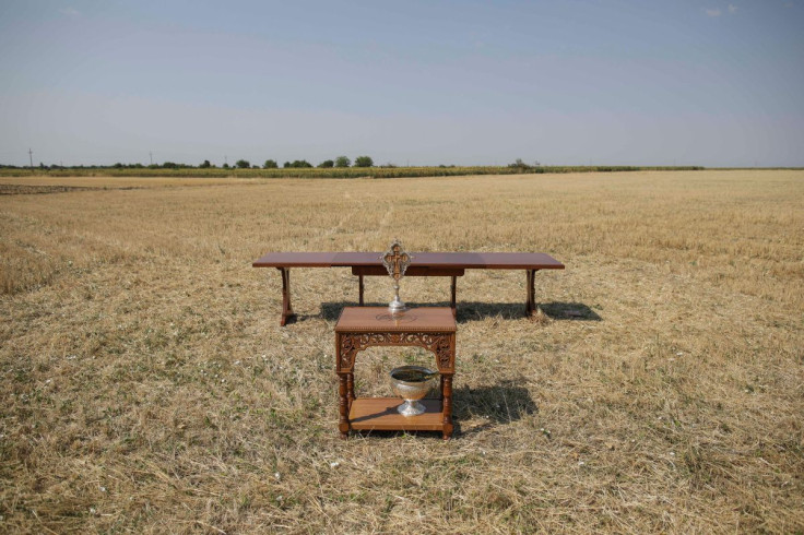 Tables are prepared for a religious service performed for rain to end the drought, in a field near Draganesti-Vlasca, Teleorman county, Romania, July 24, 2022. Inquam Photos/Octav Ganea via REUTERS