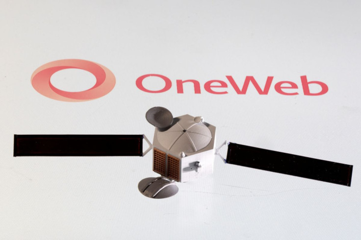 Satellite model is placed on OneWeb logo in this illustration taken April 4, 2022.