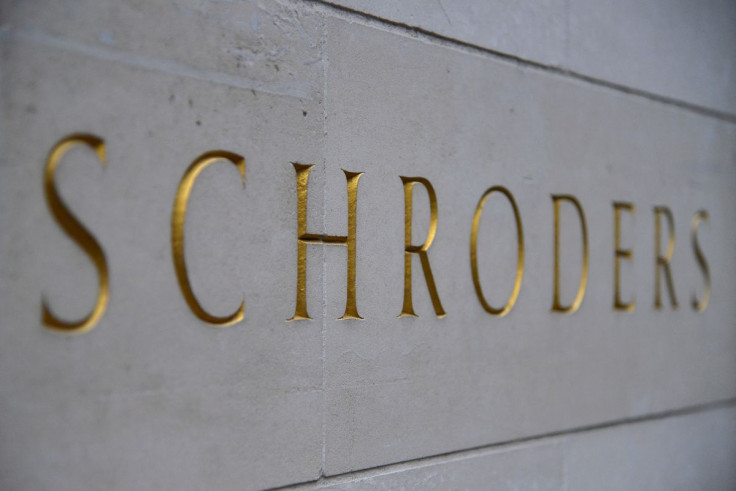 A Schroders sign is seen outside a building in the City of London, Britain, March 22, 2013. 