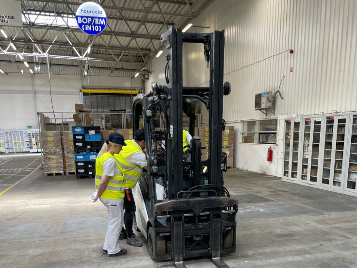 Elena Nelova, a-43-year old Ukrainian refugee woman, stands next to a forklift at a warehouse where she works in Gorzow Wielkopolski, Poland July 14, 2022.