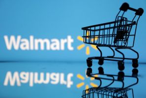Shopping trolley is seen in front of Walmart logo in this illustration, July 24, 2022. 