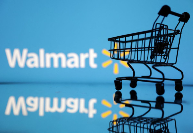 Shopping trolley is seen in front of Walmart logo in this illustration, July 24, 2022. 