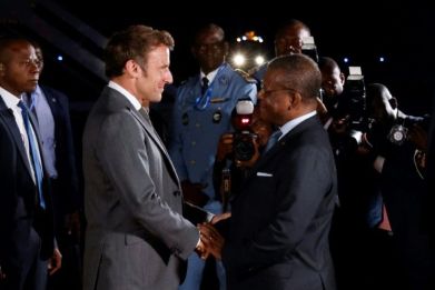 French President Emmanuel Macron is welcomed by Cameroon's Prime Minister Joseph Dion Ngute at the start of his three-nation tour of western Africa