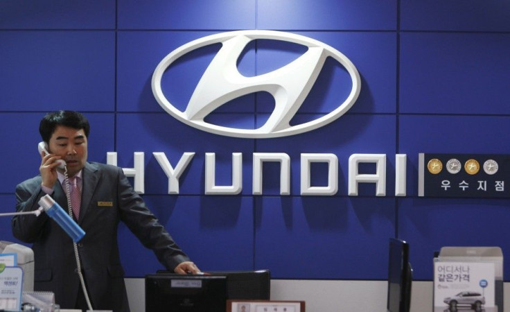 A salesman talks on a phone at a Hyundai Motor dealership in Seoul April 28, 2011.