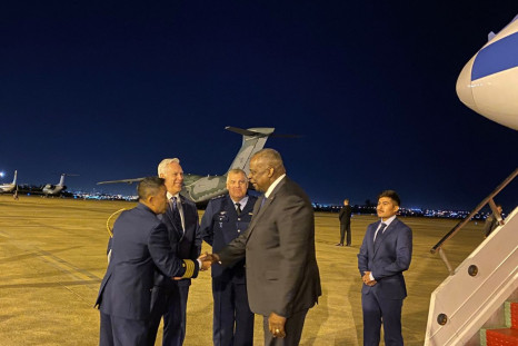 U.S. Defense Secretary Lloyd Austin is greeted upon landing in Brasilia, for a regional defense meeting, in Brazil, July 25, 2022. 