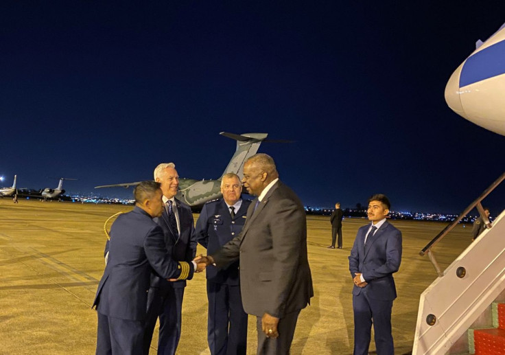 U.S. Defense Secretary Lloyd Austin is greeted upon landing in Brasilia, for a regional defense meeting, in Brazil, July 25, 2022. 