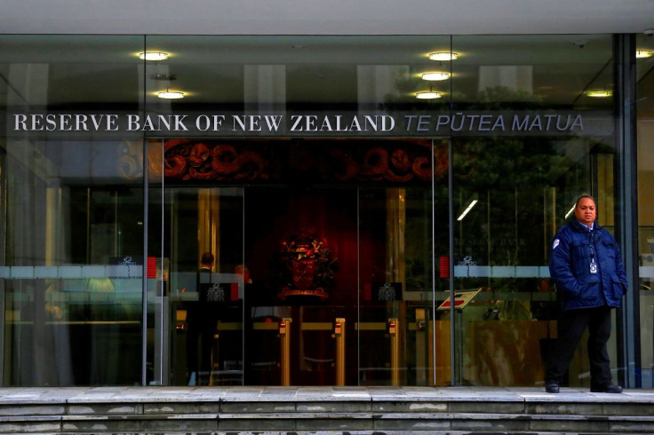 A security guard stands outside the main entrance to the Reserve Bank of New Zealand located in central Wellington, New Zealand, July 3, 2017. Picture taken July 3, 2017.