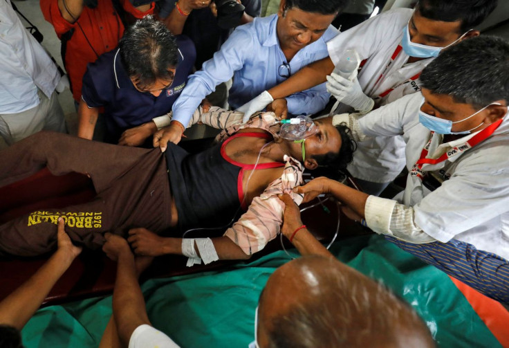 Rameshbhai Shankarbhai Rathva, 32, who according to a doctor consumed spurious liquor, is brought to a hospital for treatment in Ahmedabad, India, July 26, 2022.