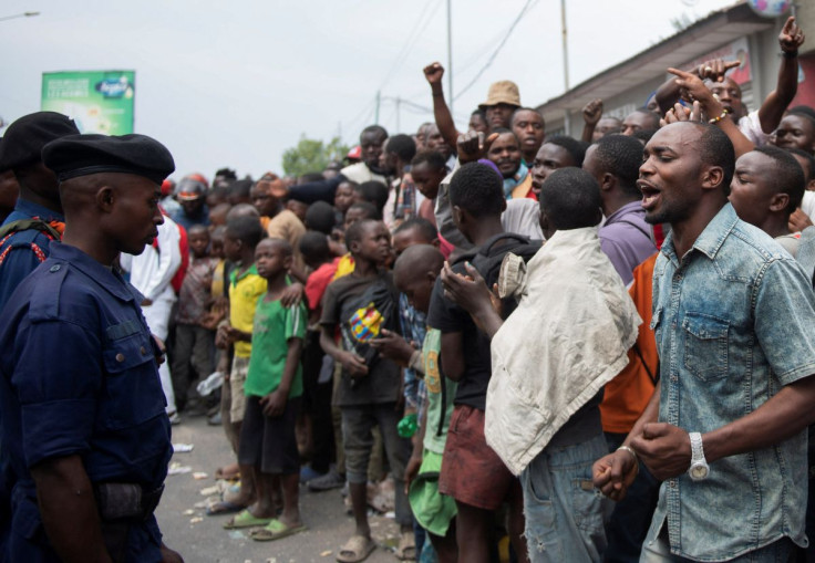 Congolese policemen stand guard to stop protesters near the compound of a United Nations peacekeeping force's warehouse in Goma in the North Kivu province of the Democratic Republic of Congo July 26, 2022.