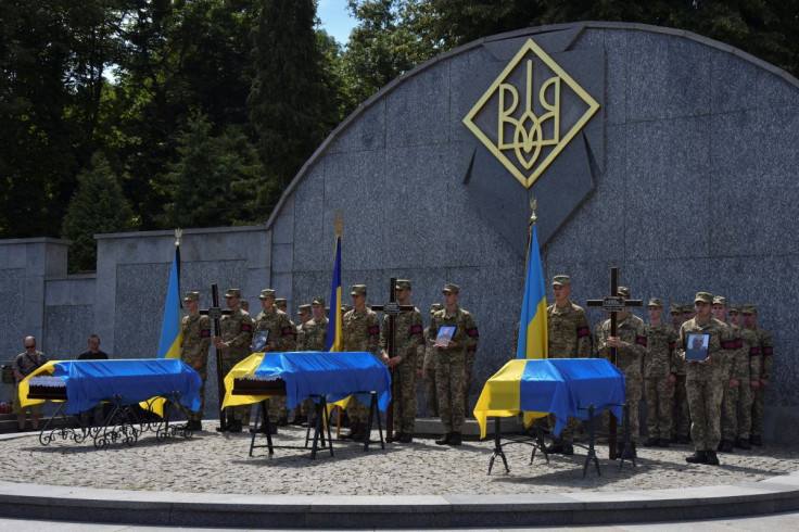 Ukrainian servicemen attend a funeral ceremony for their brothers-in-arms Volodymyr Hirniak, Serhii Kovalov and Mykola Zabavchuk, who were recently killed in a battle against Russian troops, as Russia's attack on Ukraine continues, in Lviv, Ukraine July 2