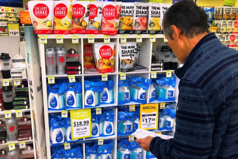A customer looks at products marked with discounted prices on display at a chemist in a shopping mall in central Sydney, Australia, July 25, 2018.    