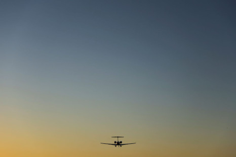 A commercial aircraft approaches to land at sun set in San Diego, California, U.S., February 28, 2022.    