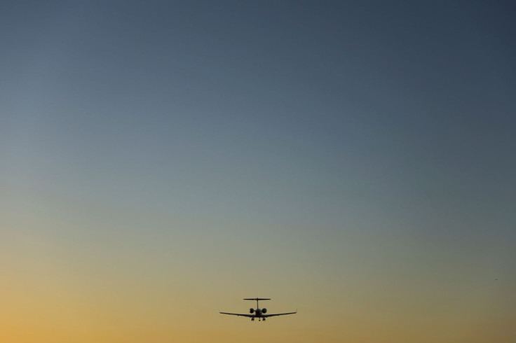 A commercial aircraft approaches to land at sun set in San Diego, California, U.S., February 28, 2022.    