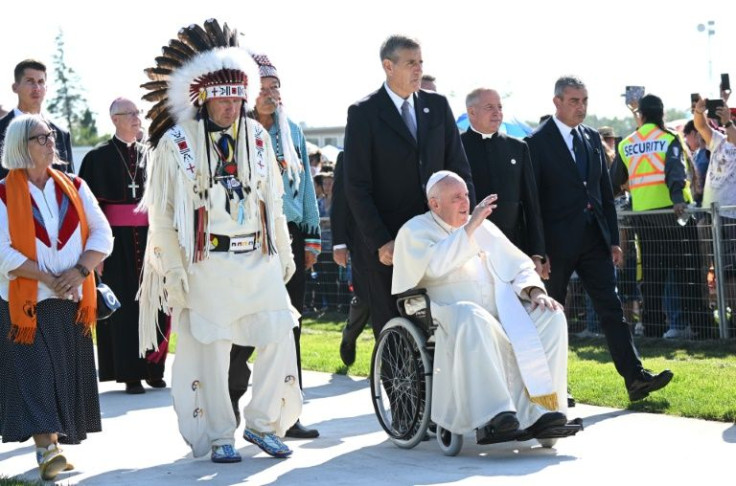Chief Tony Alexis, of the Alexis Nakota Sioux Nation, walks alongside Pope Francis as he arrives to participate in the Lac Ste. Anne Pilgrimage at Lac Ste. Anne, northwest of Edmonton, Alberta, Canada, July 26, 2022