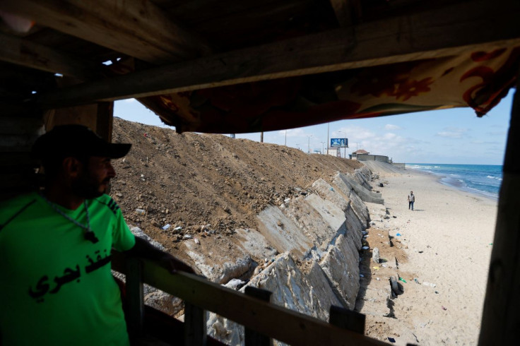 A Palestinian lifeguard looks at new concrete blocks placed on sea beaches near Al Zahra, in the central Gaza Strip July 24, 2022. 