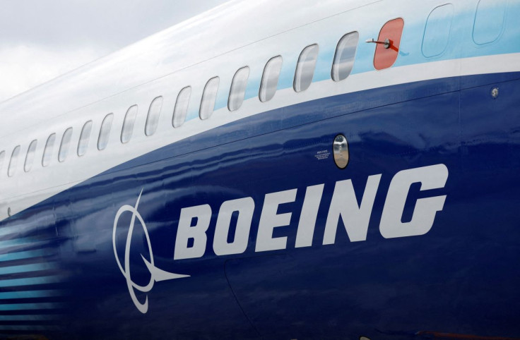 The Boeing logo is seen on the side of a Boeing 737 MAX at the Farnborough International Airshow in Farnborough, Britain, July 20, 2022.